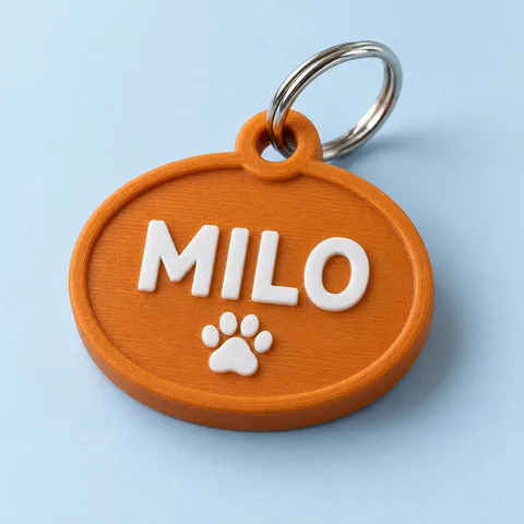 Orange pet tag with the name MILO and a white paw symbol